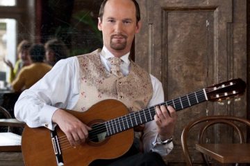 Classical guitarist Jan Depreter holding guitar