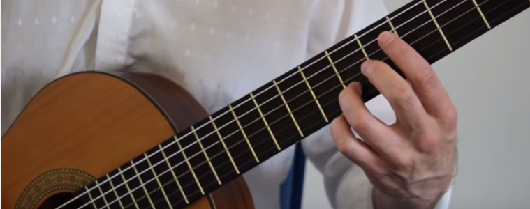 closeup of left hand holding guitar chord for Classical Guitar Lesson Tarrega Recuerdos de la Alhambra